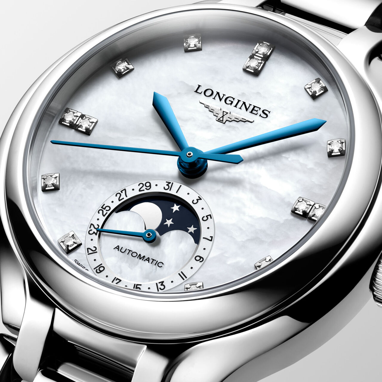 Close-up of moonphase dial with diamond accents and blue hands image number 2